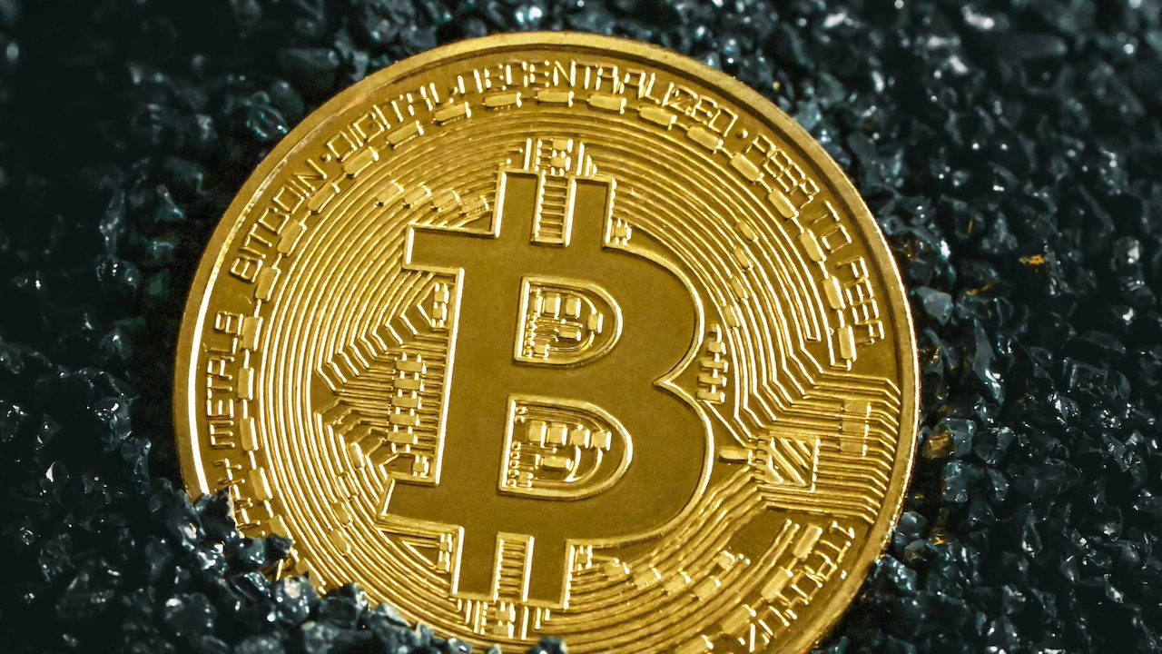 bitcoin partially covered in dirt